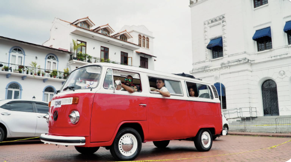 La Reina — 1969 sky blue VW Safari beside the Panama Canal
